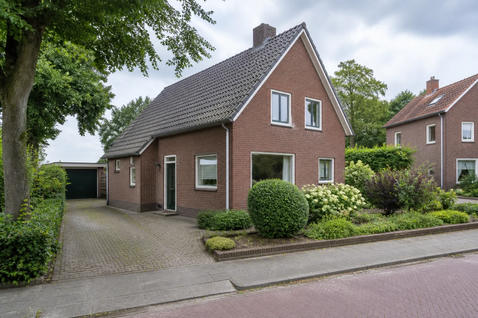Representative detached Dutch family home with garden and driveway in Aarle-Rixtel