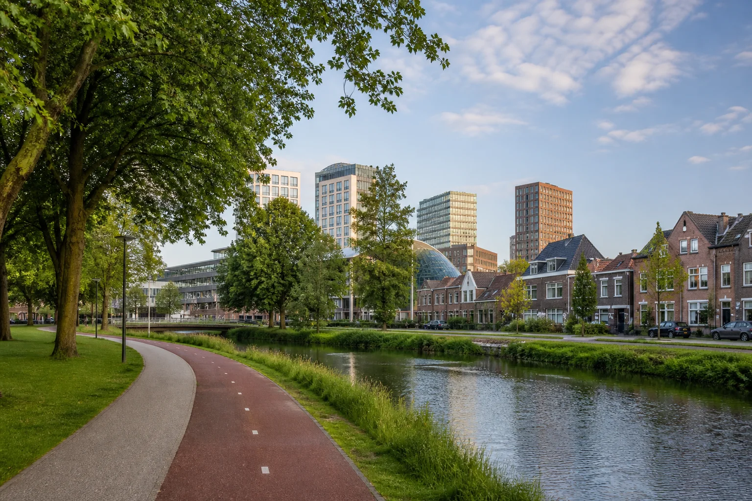 House Valuation in Eindhoven 3 Eindhoven urban-green corridor with a cycle path, water, homes and city buildings