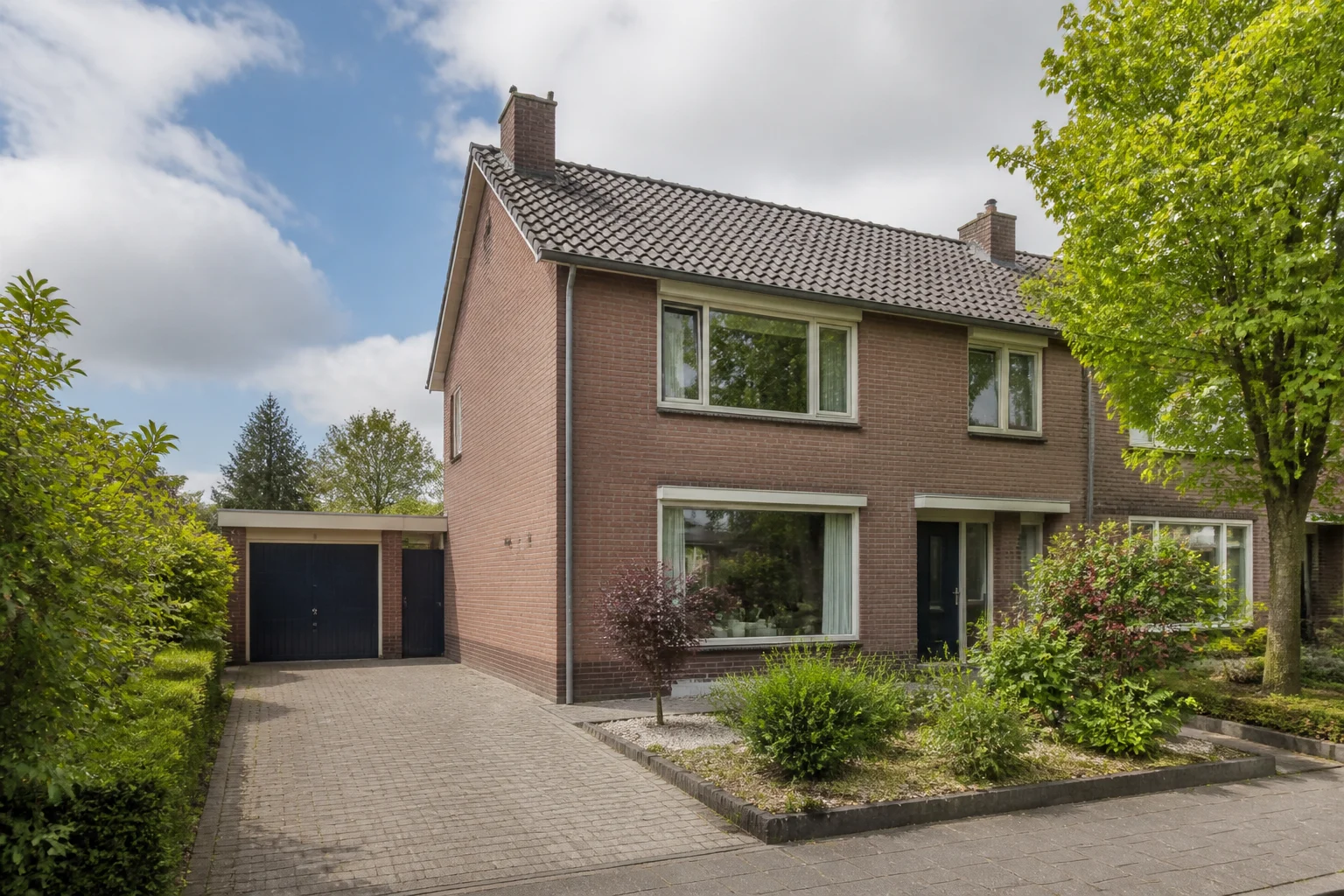 Representative detached Dutch family home with garden and driveway in Helmond