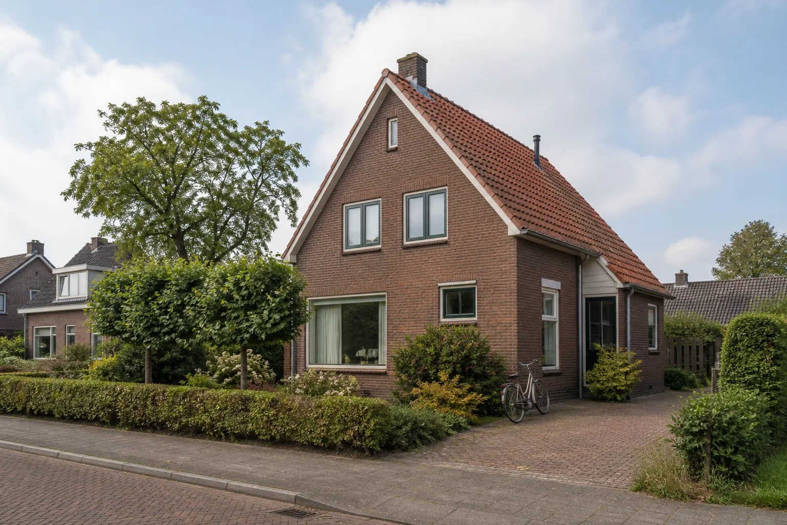 Representative detached brick family house on a quiet residential street in Sterksel